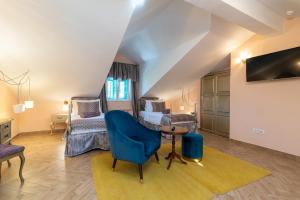 TV a/nebo společenská místnost v ubytování Heritage Hotel Pasike