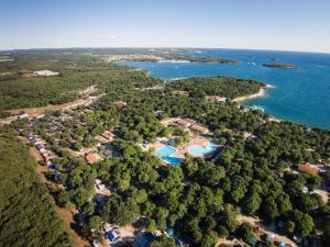 an aerial view of a resort next to the water at Easyatent Bungalow tent Bijela Uvala in Poreč