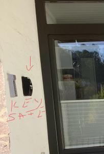 a door with writing on it next to a window at Appartement 51 in Schwäbisch Hall