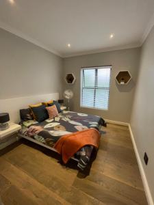 Giường trong phòng chung tại Atlantic Cove +11 ảnh