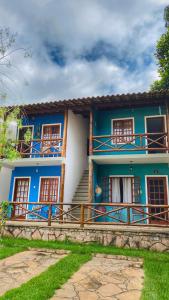 a blue and white house with stairs in front of it at Apartamento em Lencois - Bahia No 106 in Lençóis