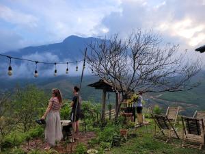 a group of people standing at a table with a view at Sapa's Soul in Sapa