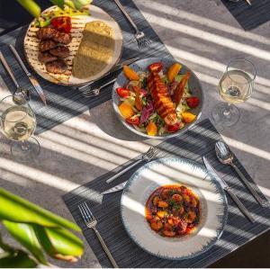 a table with two plates of food on it at Ayvalık Sea Long in Ayvalık