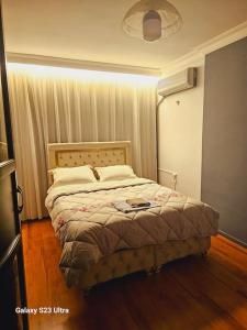a bedroom with a bed in a room at apartment 3+1 beach view in Mersin
