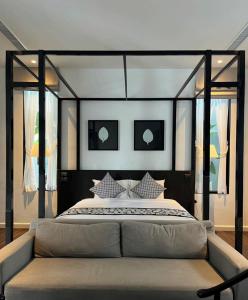 a bedroom with a large bed in a room at Yao Bada Badoo Boutique Resort in Ko Yao Yai
