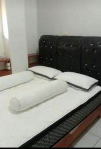En eller flere senge i et værelse på GASTRO HOMESTAY
