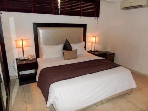Letto o letti in una camera di S & S Hotel & Suites