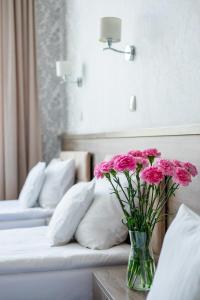 Posteľ alebo postele v izbe v ubytovaní Hotel Maximum
