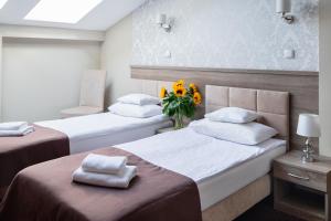 Posteľ alebo postele v izbe v ubytovaní Hotel Maximum