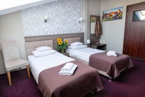 Posteľ alebo postele v izbe v ubytovaní Hotel Maximum