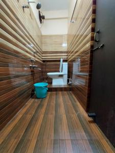 a bathroom with a toilet and a sink at Hotel Hari Gayatri Regent in Guwahati +49 photos