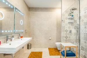 a bathroom with a sink and a toilet and a shower at City Dacha in Sliema