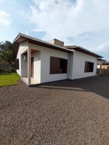 a rendering of a house with a gravel driveway at Pousada Paraíso dos Canyons in Praia Grande +11 photos
