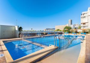 a swimming pool on the side of a building at Port Europa in Calpe