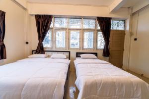 Postel nebo postele na pokoji v ubytování Joox A - Serviced Apartment