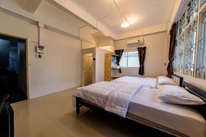 Posteľ alebo postele v izbe v ubytovaní Joox A - Serviced Apartment