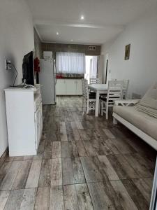 a kitchen and living room with a refrigerator and a table at CATA 1. SAN JOSE ENTRE RIOS in San José