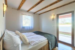 Postel nebo postele na pokoji v ubytování House Kaja