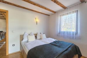 Postel nebo postele na pokoji v ubytování House Kaja