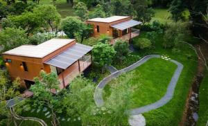 an aerial view of a home with solar panels on it at บ้านจันทร์ประดับ เขาใหญ่ in Pong Talong