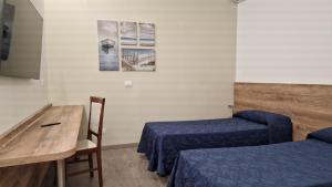 TV a/nebo společenská místnost v ubytování Hotel Milano