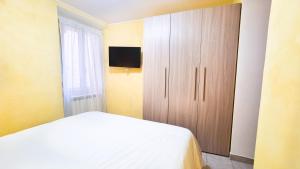 Un pat sau paturi într-o cameră la Montecelio Luxury Apartment