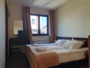 Letto o letti in una camera di Apartment ZAX B7 in Terra Complex