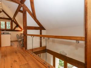 a view of a room with wooden beams at The Acorn Barn in Exeter