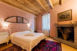 Postel nebo postele na pokoji v ubytování B&B Corte del Mincio