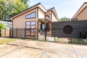 a house with a black fence in front of it at 1921 Walnut in Cloverdale in Montgomery