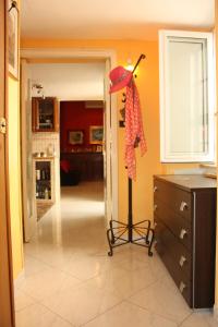 a red umbrella on a stand in a kitchen at Casa Vacanza Da Andrea in Naples