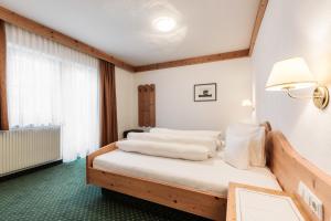 Postel nebo postele na pokoji v ubytování Hotel Regina