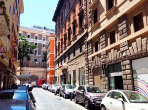 cars parked on the side of a street at B&B Hotel Roma Italia Viminale in Rome