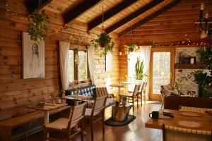a dining room with tables and chairs in a cabin at Sowilo All-inclusive Resort in Greenwich