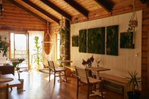 a living room with tables and chairs in a building at Sowilo All-inclusive Resort in Greenwich