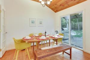 a dining room with a wooden table and chairs at Narrowsburg Home with Backyard Near Delaware River! in Narrowsburg