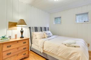 a bedroom with a bed and a dresser and a lamp at Narrowsburg Home with Backyard Near Delaware River! in Narrowsburg
