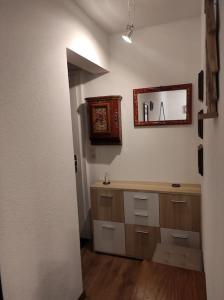 a bathroom with a sink and a mirror on the wall at Petit paradis cocooning avec balcon à Torgon in Vionnaz