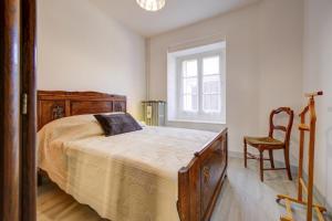 Ένα ή περισσότερα κρεβάτια σε δωμάτιο στο Le Relais Champenois