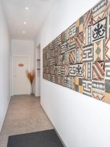 a hallway with a mural on the wall at Zuara9Room Rimini in Rimini