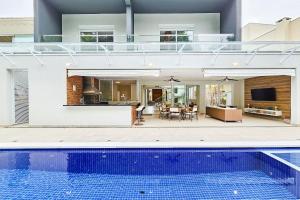 Kolam renang di atau dekat dengan Casa de 400m² e piscina próximo à praia +65 gambar