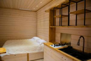a sauna with a bed and a sink in it at ARTEMIDE "Corte Segreta" B&B SUITE SPA in San Cipriano Picentino