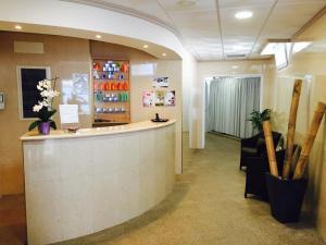 a lobby with a counter and a waiting room at Hotel Nuevo Vichona Spa 3 estrellas Superior in Sanxenxo +33 photos