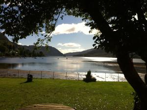 a view of a lake with mountains in the background at The Shore House in Lochgoilhead +77 photos