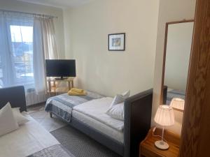 Postel nebo postele na pokoji v ubytování Gościniec Jantar