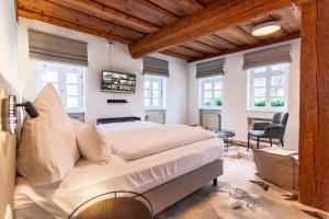 Postel nebo postele na pokoji v ubytování Hotel Tuchhaus