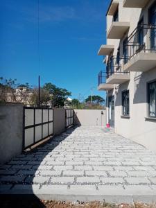 a stone walkway in front of a building at Kestrel Appartment in Grand-Baie