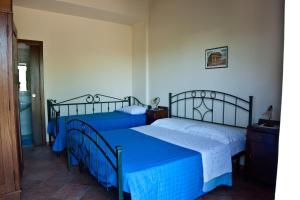 Cama ou camas em um quarto em B&B Terre di Paestum