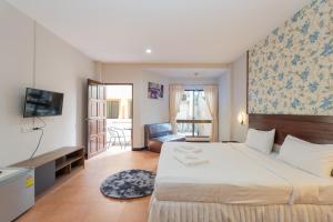 Postel nebo postele na pokoji v ubytování Amarin Hotel Patong + 37 fotografií