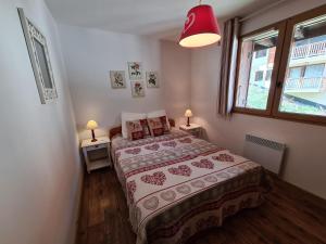 Ένα ή περισσότερα κρεβάτια σε δωμάτιο στο Appartement cosy, 6 personnes, 2 chambres - MONTA12